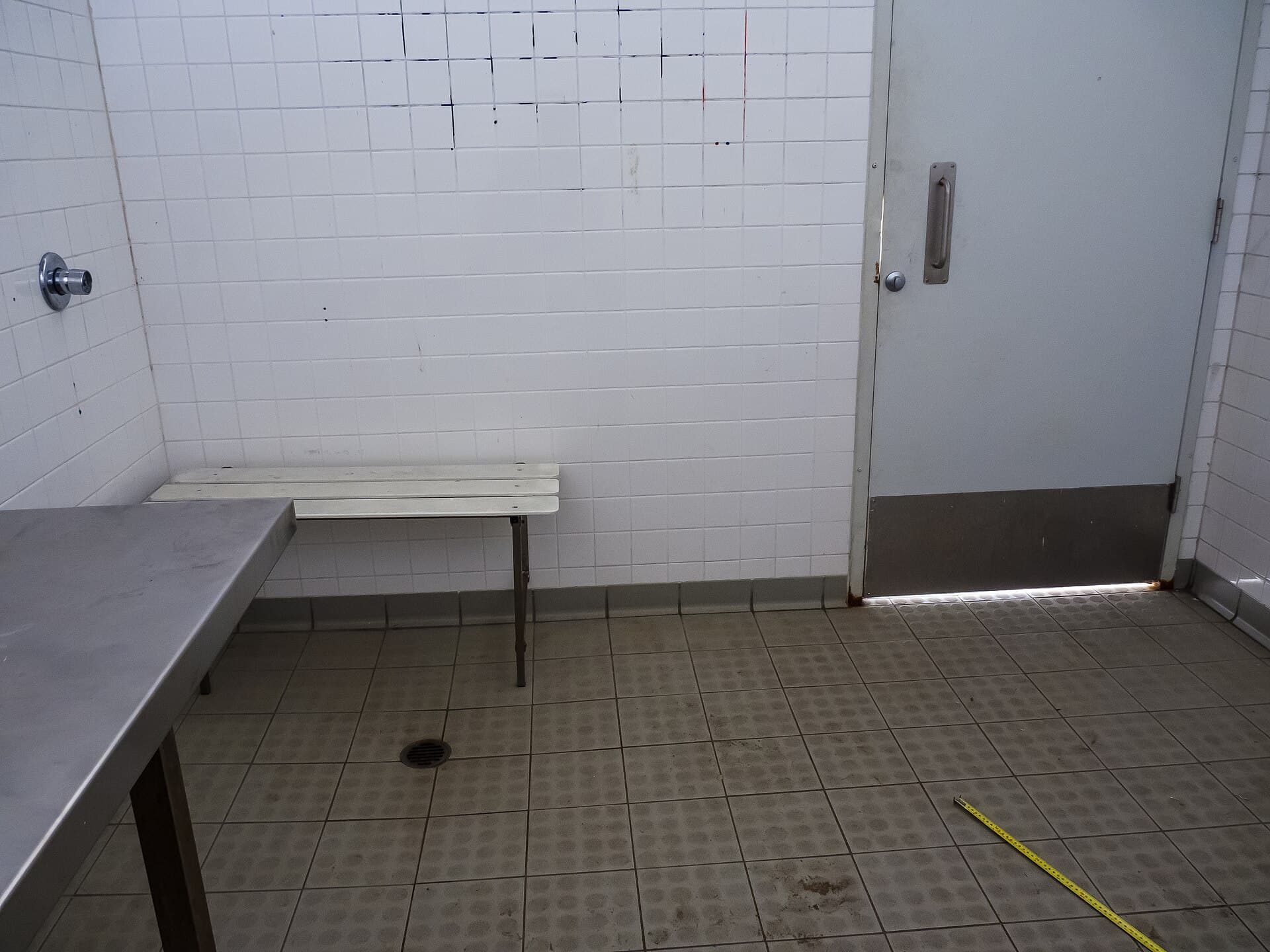 An Australian accessible shower room with a fold-down seat and grab rails at Moora Park, Shorncliffe